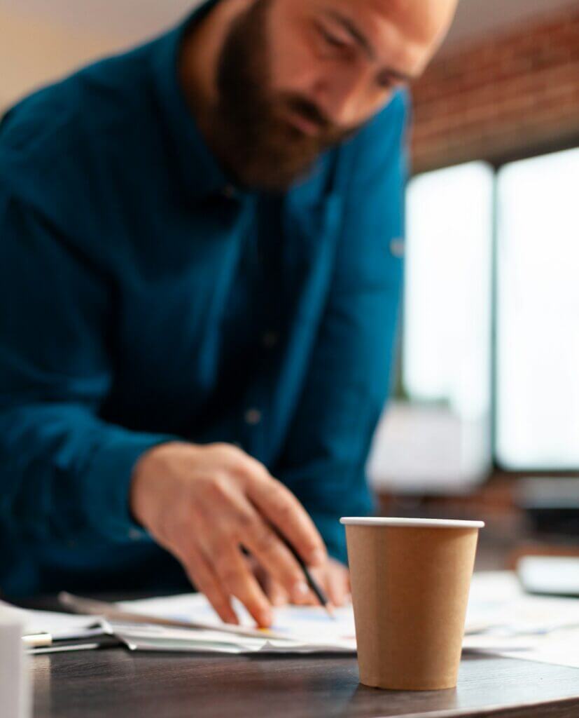 Bookkeeper man planning company meeting analyzing marketing strategy papers working at investment