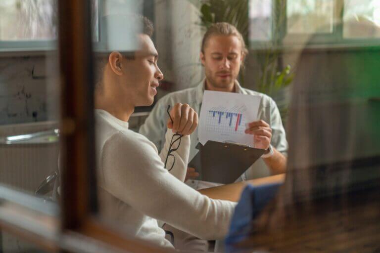 Business team sitting inside a meeting room and discussing work.